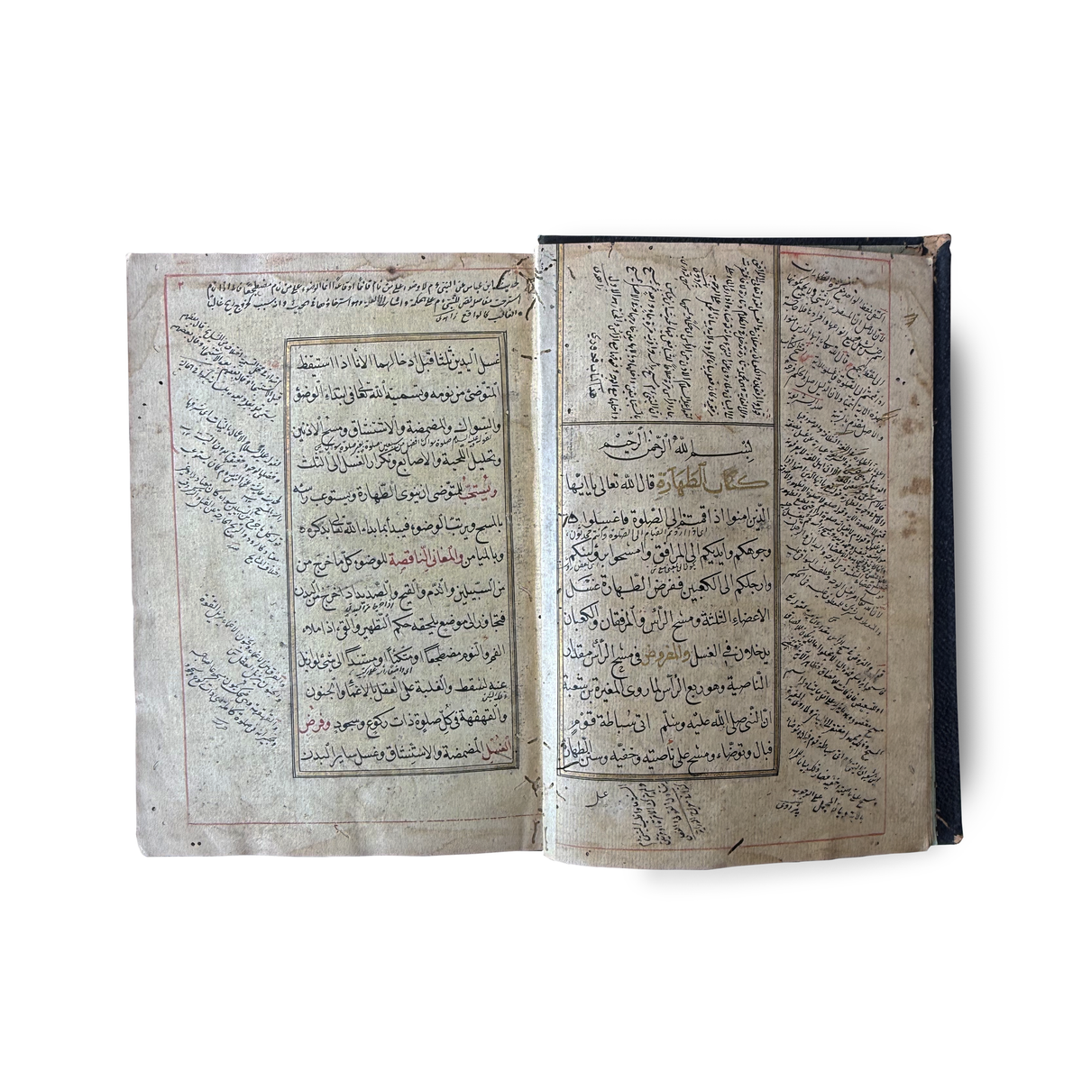 Ottoman Arabic manuscript — open spread showing text with rubrication and marginal notes