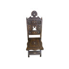 Pair of Syrian walnut folding chairs — front view showing carved back and mother-of-pearl inlay