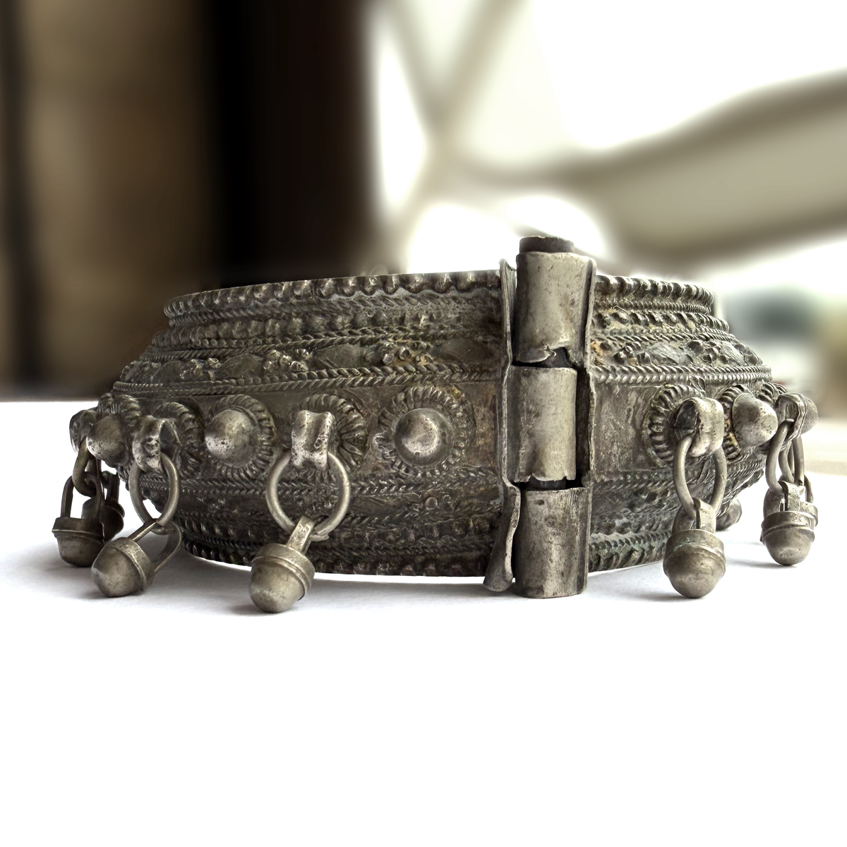 Antique Arabian Silver Hinged Bangle with Bell Drops and Garnet Clasp