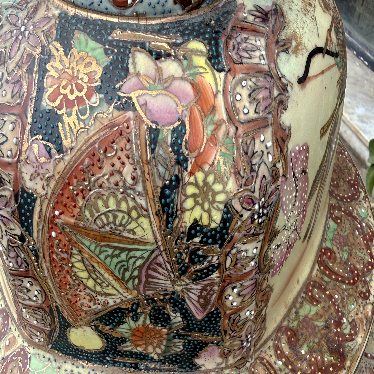 Detail of lower body panel showing hairline crack and warrior cartouche