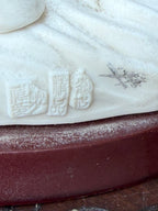 Three impressed seal-script marks on underside of base