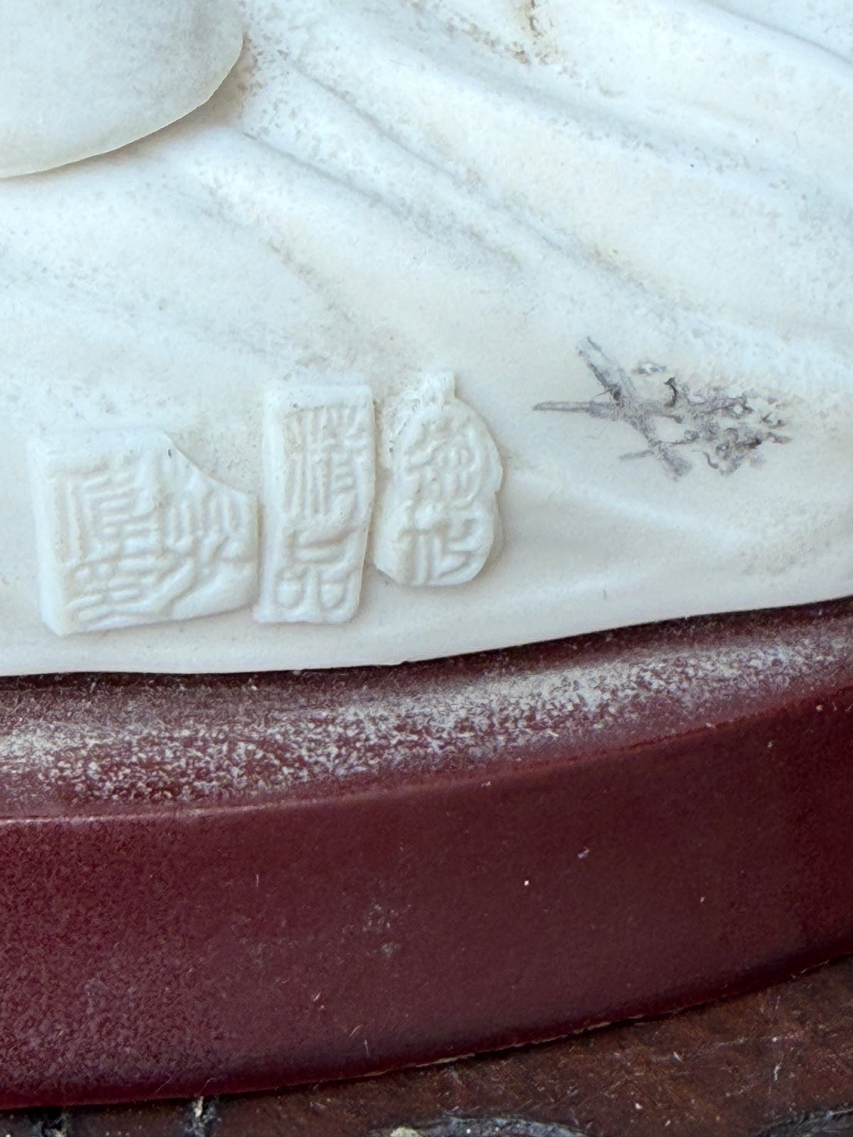 Three impressed seal-script marks on underside of base