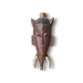 Guro Baule African tribal mask front – hand-carved hardwood with animal horns, incised markings, domed dark cap and wooden finial